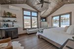 Private master bedroom with king bed, private deck and mini bar 